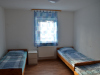 Schlafzimmer mit Einzelbetten - Unterkunft + Grünberg